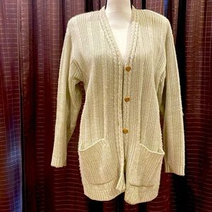 Beige cardigan sweater with 5 gold buttons.